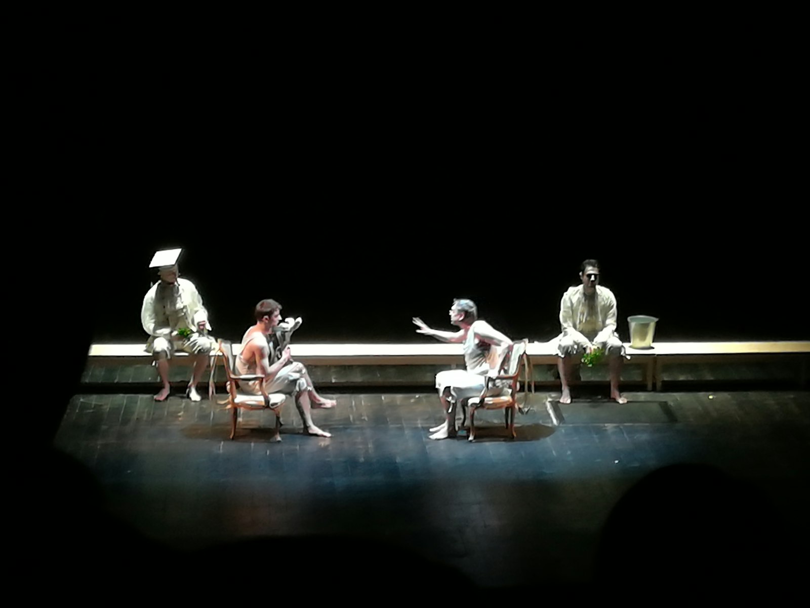 Actors performing a scene on stage